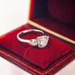 rd001 14k White Gold 2.00 Carat Round Lab-Grown Diamond E VVS2 Three-Stone Ring with Pear Side Stones